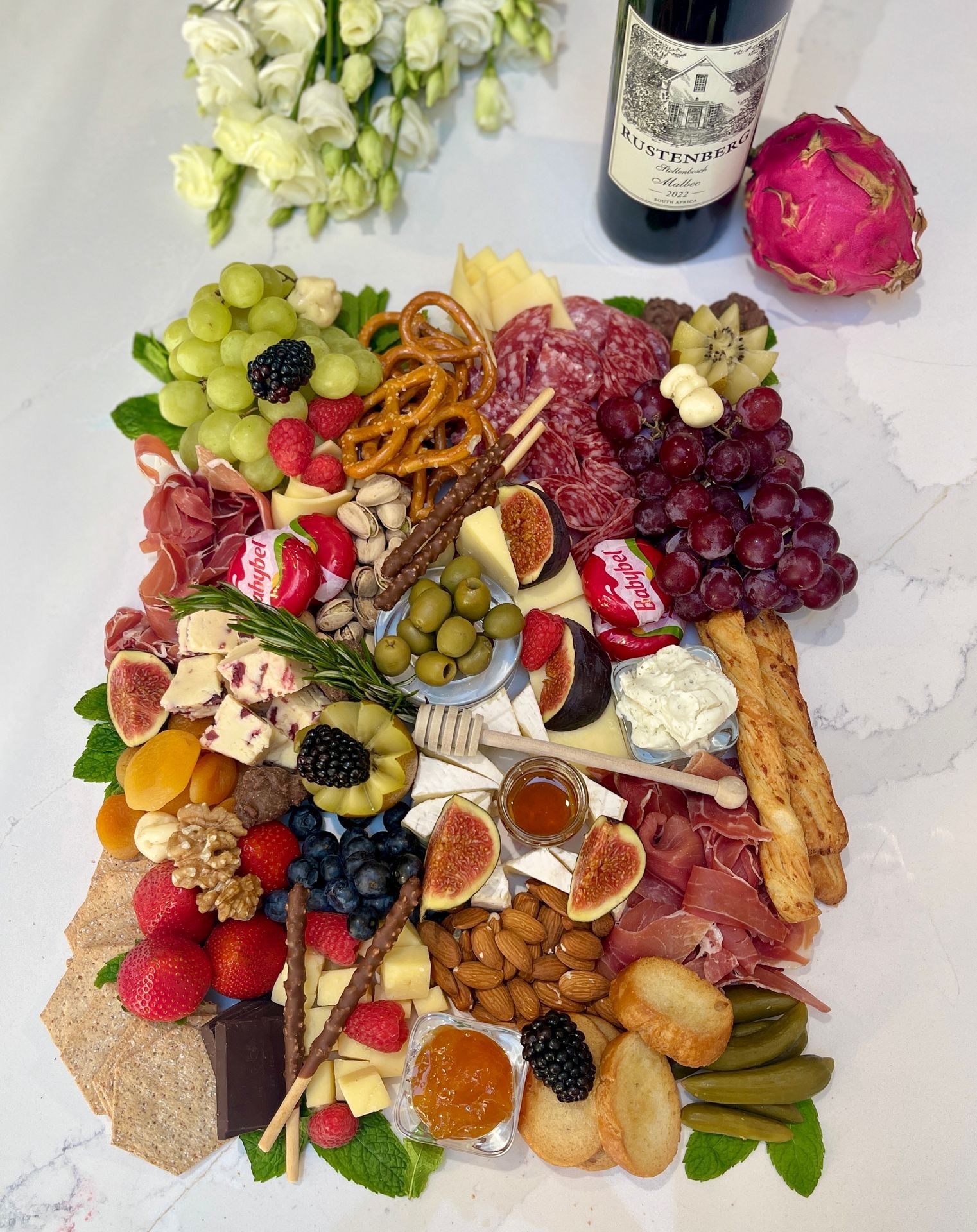 Medium charcuterie. It serves approximately 10 guests. Size 22"x12".